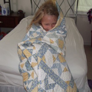 Sarah loves to HUG her quilts!