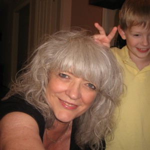 Cooper putting rabbit ears on GRANDMA THE GROWNUP