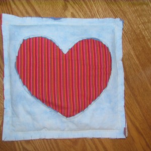 Front of Reverse Applique Raggedy Heart Heat Buddy