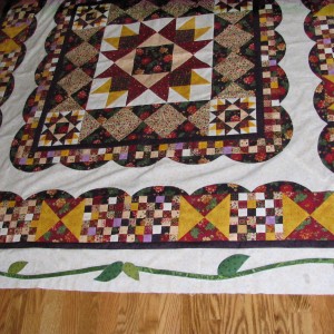 One border with vines on the Birth of a Sampler Quilt
