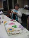Maggie - the knitter and creator of her first quilt - Grandmother's Flower Garden
