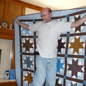 Fred and his quilt (wearing one of his POCKET Ts)