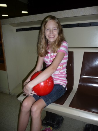 Leanna has to have a bowling ball to match her shirt!