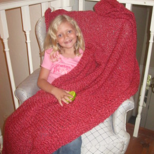 Red knitted afghan shown here with Grandangel Shirley Anne Johnson