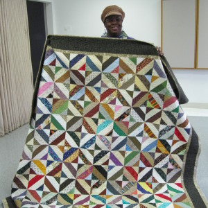 Bonnie was binding her BONNIE HUNTER "Hidden Spools Quilt" today.