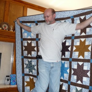 Fred and his Quilt - Note he is wearing one of his Pocket Ts!