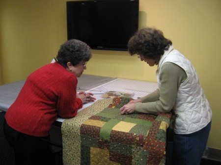 Marla helping Shirley with her first quilt