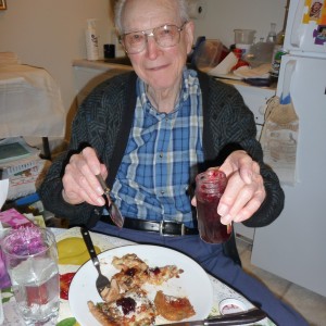 Daddy eating jelly on his pizza