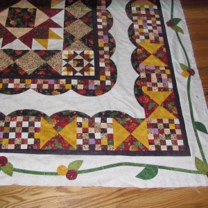 Gold and Burgundy Flowers on my Birth of a Sampler Quilt