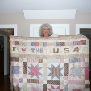 SAO Holding the STAR DETOUR QUILT with the FOLK ART LETTER BORDER